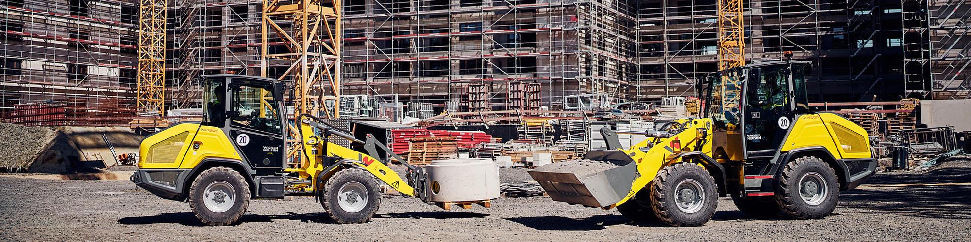 De krachtige wielladers WL750p en WL950p van Wacker Neuson aan het werk op een bouwplaats.