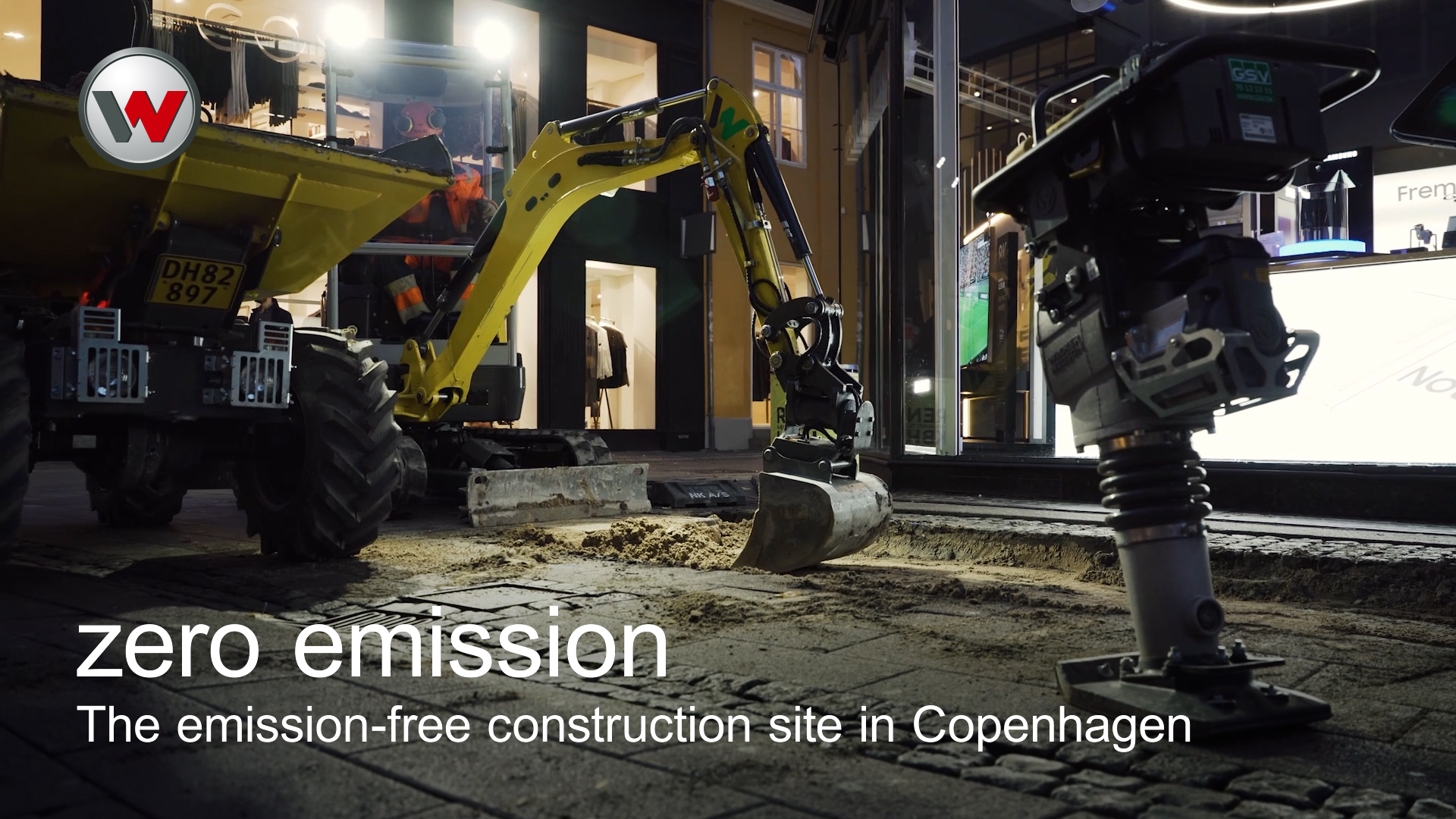 excavator and dumper working in the streets of copenhagen at night
